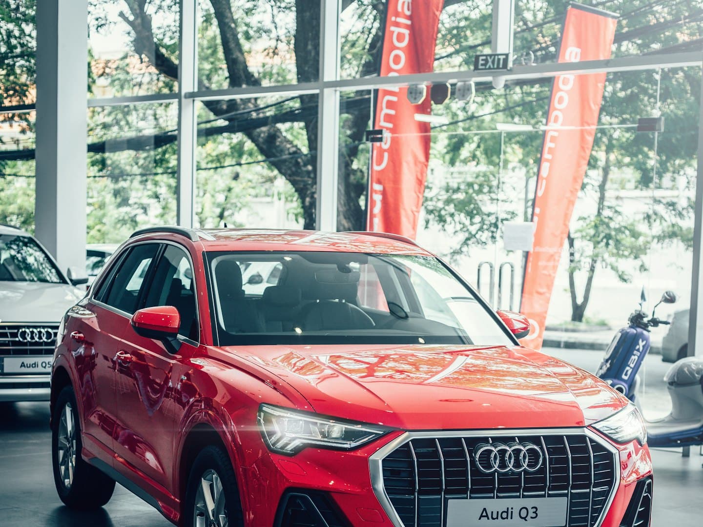 A red SUV in a car showroom