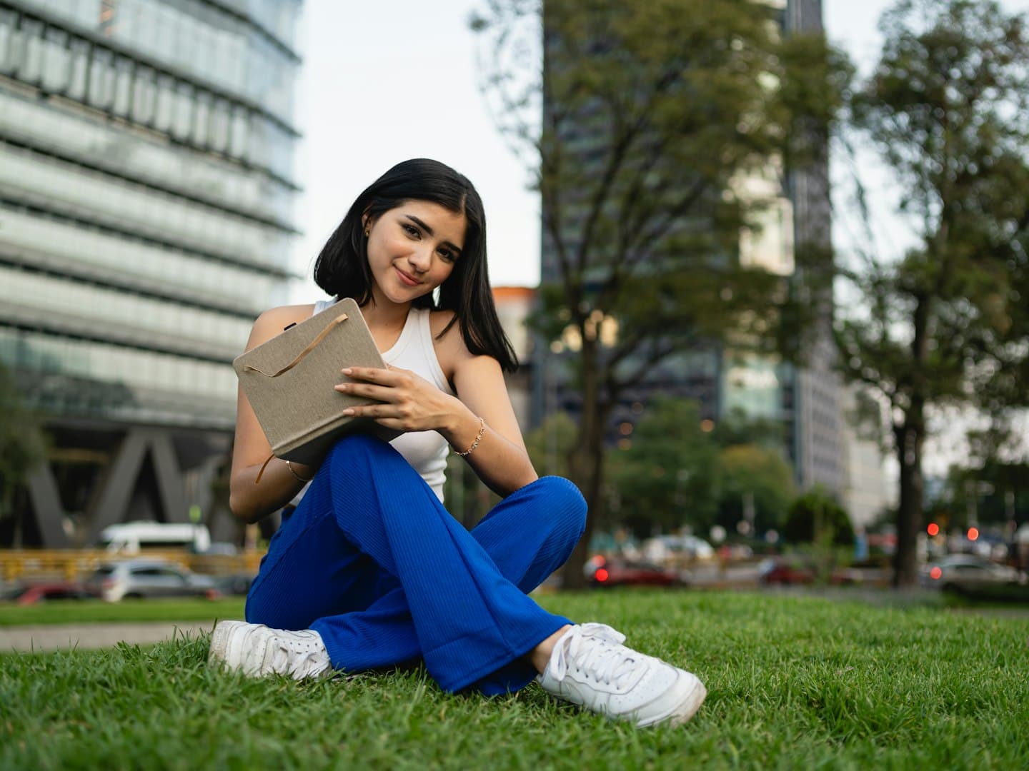 A woman holding a parcel and smiling