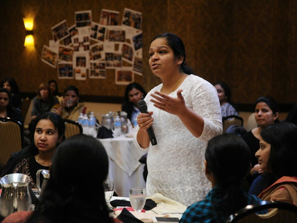 A teacher speaking to a room of students